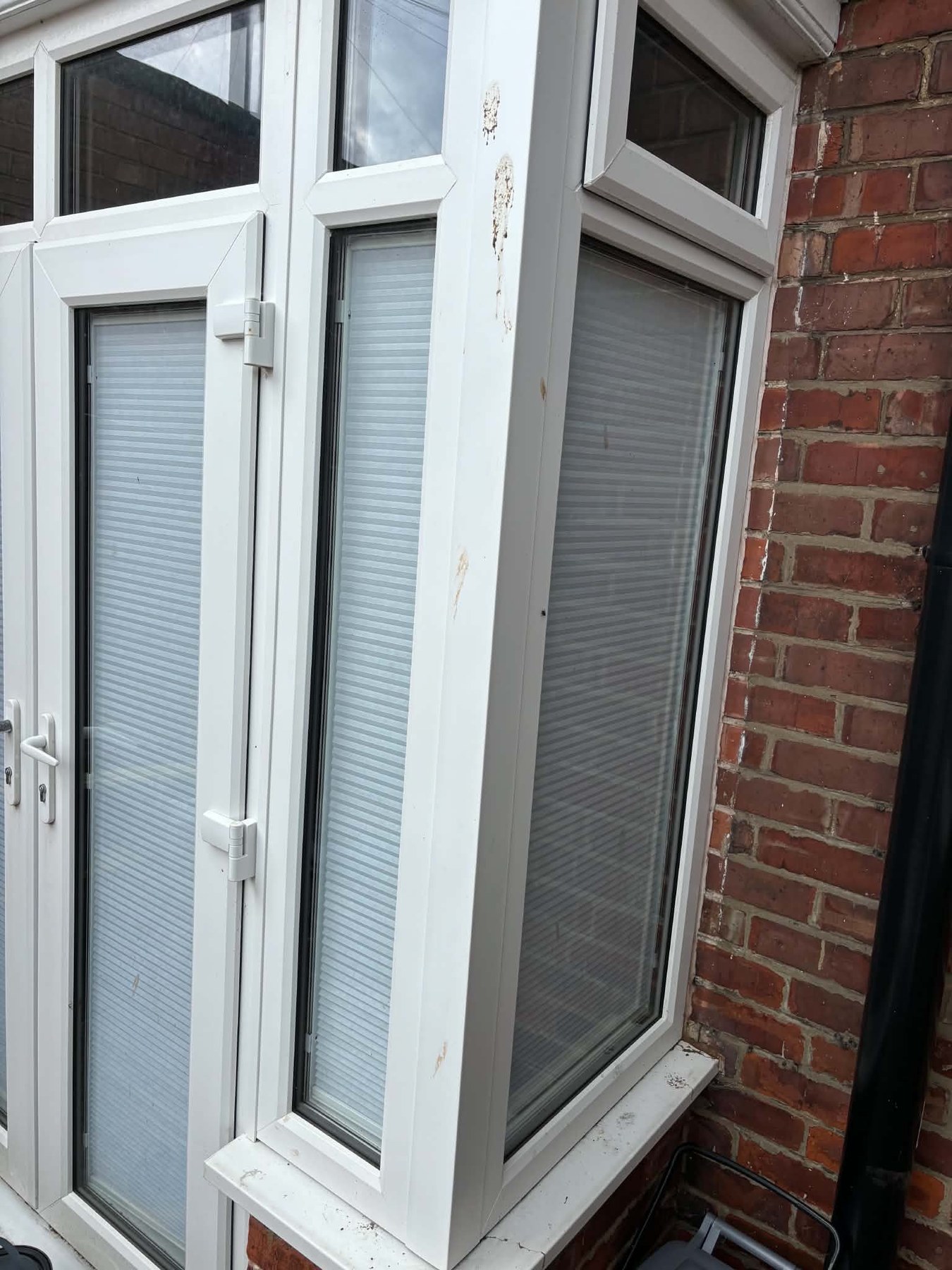 Before: weathered frames and sills, booked in for a proper clean